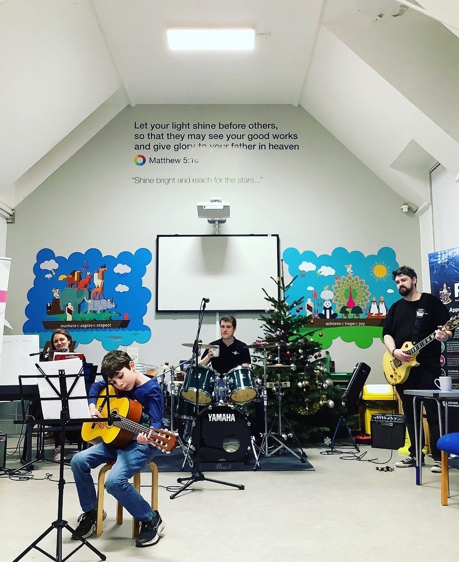 Children playing instruments at Christmas Concert