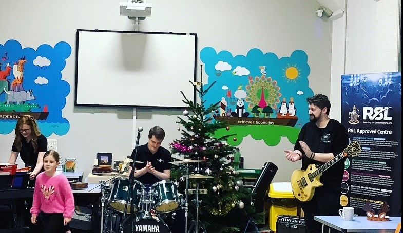 Children playing instruments at Christmas Concert